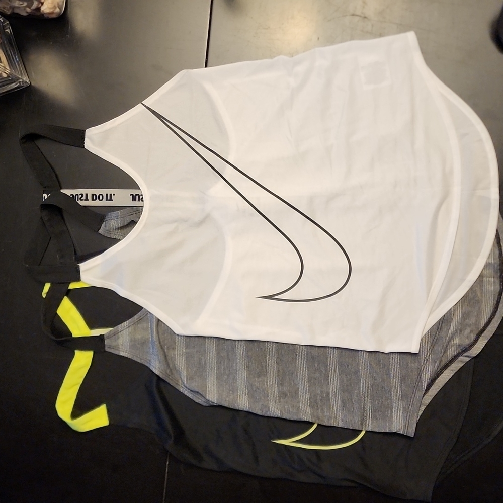 Three XS Nike Tank Tops